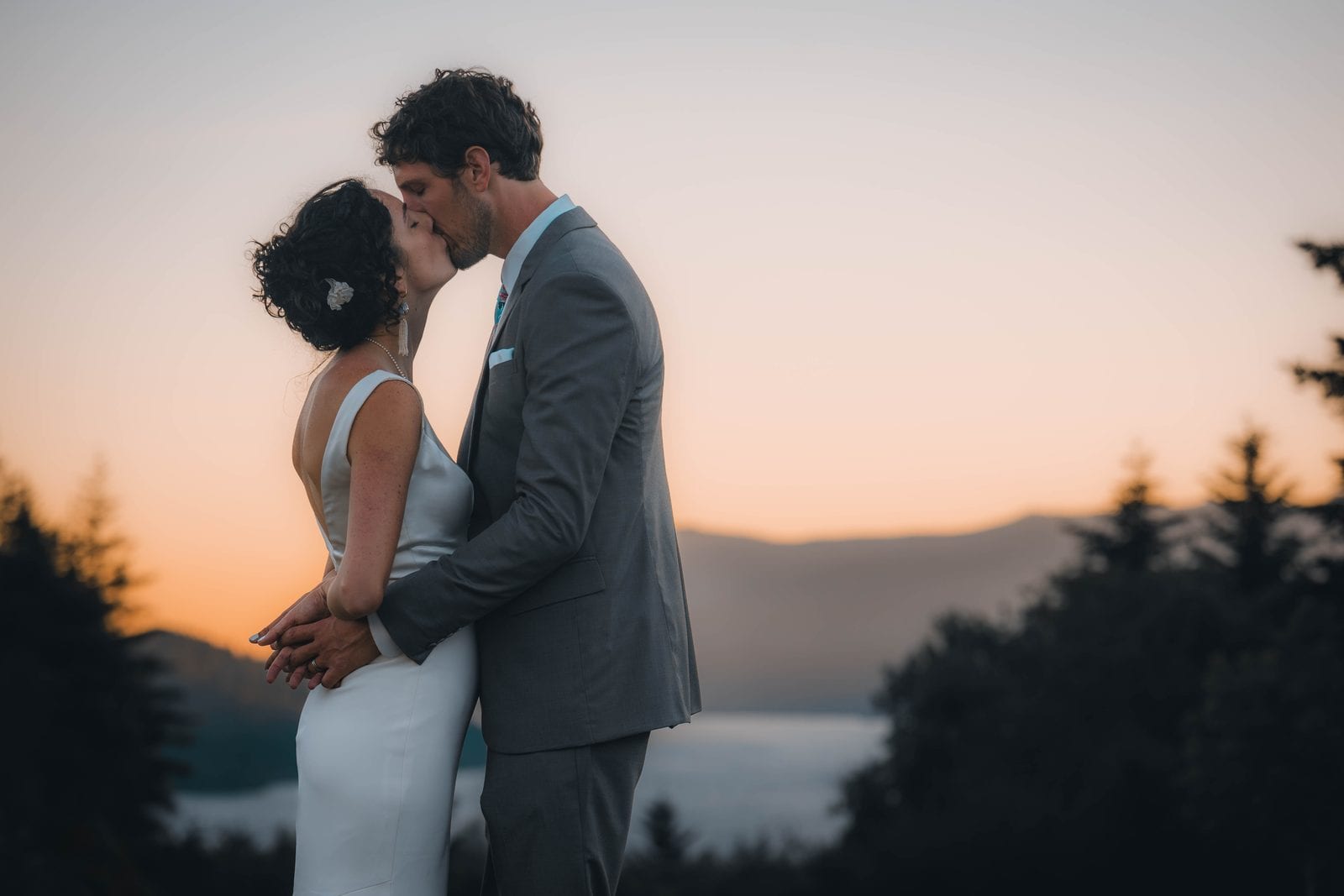 The couple's kiss at sunset